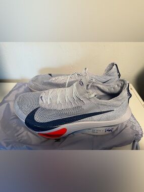 Nike Running Shoe with Purple Knit Upper and Teal Insole Accent